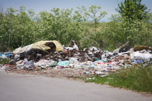 Workers sorting recyclables at a commercial waste site